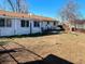View of the backyard with a barbeque and a wood bench at 3190 S Joplin Ct, Aurora, CO 80013