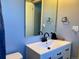 Bathroom featuring a mirror, sink with a white vanity, and a toilet at 3190 S Joplin Ct, Aurora, CO 80013