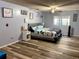 Cozy bedroom featuring hardwood floors and a ceiling fan at 3190 S Joplin Ct, Aurora, CO 80013