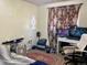Bedroom with paneled curtains, a ceiling fan, and a desk with two computer monitors at 3190 S Joplin Ct, Aurora, CO 80013