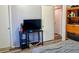 Bedroom featuring a door to the next room, and an entertainment center at 3190 S Joplin Ct, Aurora, CO 80013