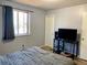 Bedroom featuring a window, closet, and TV on an entertainment center at 3190 S Joplin Ct, Aurora, CO 80013