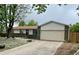 Ranch home with brick accents, neutral siding, well kept lawn, and an attached two-car garage at 3190 S Joplin Ct, Aurora, CO 80013