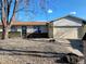 Inviting single-story home with decorative rock, a 2-car garage, and mature trees at 3190 S Joplin Ct, Aurora, CO 80013