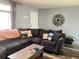 Inviting living room with wood flooring, a sectional sofa, and decorative elements at 3190 S Joplin Ct, Aurora, CO 80013