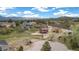 A high angle aerial view of the property showing multiple houses and gorgeous landscape at 826 Meadow Ln, Palmer Lake, CO 80133
