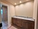 Bathroom featuring double sink granite vanity with walk-in tiled shower, recessed lighting and modern fixtures at 826 Meadow Ln, Palmer Lake, CO 80133