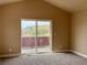 Bright bedroom with new carpet and a sliding glass door leading to a balcony at 826 Meadow Ln, Palmer Lake, CO 80133
