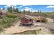 Stunning two-story home with wood exterior, covered porch and mountain views at 826 Meadow Ln, Palmer Lake, CO 80133