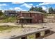 Beautiful multi-story home with a covered porch and a well-manicured landscape at 826 Meadow Ln, Palmer Lake, CO 80133