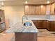 Bright kitchen with wooden cabinets, stainless sink, and granite countertops, perfect for cooking and entertaining at 826 Meadow Ln, Palmer Lake, CO 80133