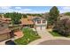 Aerial view of a charming home with well-maintained landscaping, dual garage, and solar panels at 11149 Seton Pl, Westminster, CO 80031