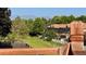 A lovely backyard view of the home with lush greenery and serene mountain views on a bright sunny day at 11149 Seton Pl, Westminster, CO 80031