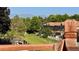 Home featuring a backyard with a view of lush trees and mountains beyond the neighboring houses at 11149 Seton Pl, Westminster, CO 80031
