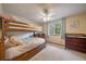 Cozy bedroom featuring a wooden bunk bed with floral bedding and a ceiling fan at 11149 Seton Pl, Westminster, CO 80031