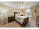 Cozy bedroom featuring a full bed, a ceiling fan, and a window with natural lighting at 11149 Seton Pl, Westminster, CO 80031