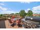 A comfortable deck with outdoor seating and a barbeque grill with a beautiful view of the neighborhood at 11149 Seton Pl, Westminster, CO 80031