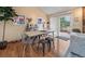 Bright dining area with modern table set, stylish decor, and sliding door access to the outdoor deck at 11149 Seton Pl, Westminster, CO 80031