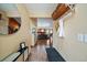 Foyer with tiled floor, coat rack, mirror, and a view into the living room at 11149 Seton Pl, Westminster, CO 80031