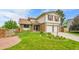 Charming two-story home featuring a well-manicured lawn and a two-car garage at 11149 Seton Pl, Westminster, CO 80031