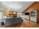 Bright living room with a brick fireplace, hardwood floors, skylights, and comfortable seating at 11149 Seton Pl, Westminster, CO 80031