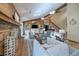 Inviting living room with brick fireplace, hardwood floors, comfortable seating, and natural lighting at 11149 Seton Pl, Westminster, CO 80031