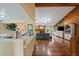Spacious living room featuring hardwood floors, fireplace, skylights, and vaulted ceilings at 11149 Seton Pl, Westminster, CO 80031