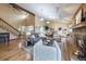 Spacious living room with vaulted ceilings, hardwood floors, brick fireplace, and modern furnishings at 11149 Seton Pl, Westminster, CO 80031