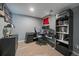 Functional office space with a modern desk setup, dark accents, and ample storage at 11149 Seton Pl, Westminster, CO 80031