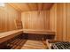 An indoor sauna with wooden walls, benches, and a heating element for a relaxing experience at 11149 Seton Pl, Westminster, CO 80031