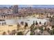 Scenic view of City Park with a serene lake, lush greenery, and a cityscape backdrop at 2800 N Harrison St, Denver, CO 80205