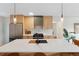Modern kitchen boasts white countertops, wood cabinets, and stainless steel appliances at 2800 N Harrison St, Denver, CO 80205