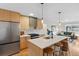 Modern kitchen features a large island, wood cabinets, and stainless steel appliances at 2800 N Harrison St, Denver, CO 80205