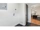 Bright laundry area with black hexagon tile floor and adjacent dining room at 2800 N Harrison St, Denver, CO 80205