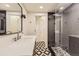Bathroom featuring stylish tile, a glass enclosed shower, and modern vanity at 8982 Spaulding St, Parker, CO 80134