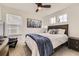 Bedroom featuring a large window, ceiling fan, and modern decor at 8982 Spaulding St, Parker, CO 80134