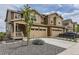 Charming home featuring a well-manicured lawn, two-car garage, and stylish exterior at 8982 Spaulding St, Parker, CO 80134
