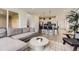 Bright, open-concept living room and kitchen featuring modern décor and lots of natural light at 8982 Spaulding St, Parker, CO 80134