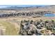Community overview with a lush golf course and lake at 6406 Eagle Ct, Longmont, CO 80503