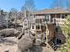Expansive backyard featuring a multi-level deck, hot tub, and stone patio perfect for outdoor entertaining at 6406 Eagle Ct, Longmont, CO 80503