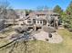 Expansive backyard with stone patio, deck, mature trees and landscaping offers great outdoor space at 6406 Eagle Ct, Longmont, CO 80503