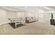 Finished basement featuring plush carpeting, ping pong table, and comfortable seating area at 6406 Eagle Ct, Longmont, CO 80503
