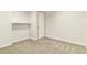 Unfinished basement featuring neutral carpet, shelving unit, and a single window at 6406 Eagle Ct, Longmont, CO 80503
