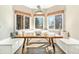 Cozy breakfast nook with built-in seating, natural light, and a welcoming atmosphere at 6406 Eagle Ct, Longmont, CO 80503