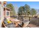 Relaxing deck with outdoor seating perfect for enjoying views of the manicured yard and wooded surroundings at 6406 Eagle Ct, Longmont, CO 80503