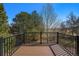 Expansive deck featuring metal railings and tranquil views of the well-manicured backyard at 6406 Eagle Ct, Longmont, CO 80503