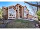 Stunning two-story home with manicured lawn, lush landscaping, and attached garage offers great curb appeal at 6406 Eagle Ct, Longmont, CO 80503