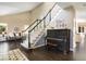 Bright foyer with hardwood floors, grand staircase, and elegant decor creates a stunning entrance at 6406 Eagle Ct, Longmont, CO 80503
