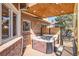 Outdoor deck featuring a hot tub, offering a private space for relaxation and enjoying the outdoors at 6406 Eagle Ct, Longmont, CO 80503