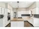Gourmet kitchen with a large island, professional-grade appliances, and a stylish backsplash at 6406 Eagle Ct, Longmont, CO 80503